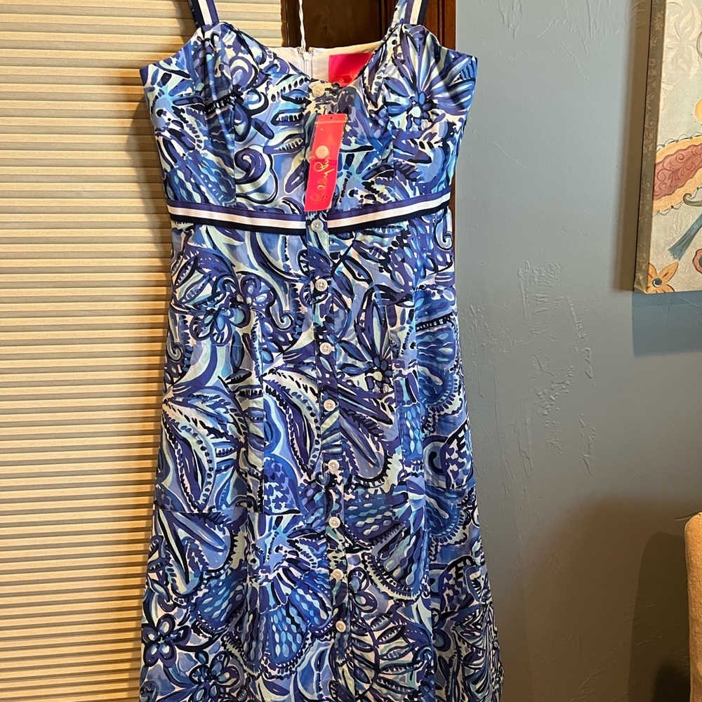 New Lily blue floral dress size 8. Strappy, with pockets.